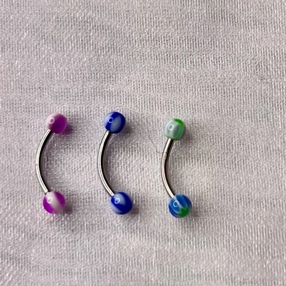 Colorful Curved Barbell Piercings